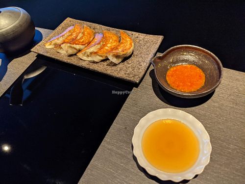 Gyoza and sauces at Vegan Ramen UZU Kyoto in Kyoto