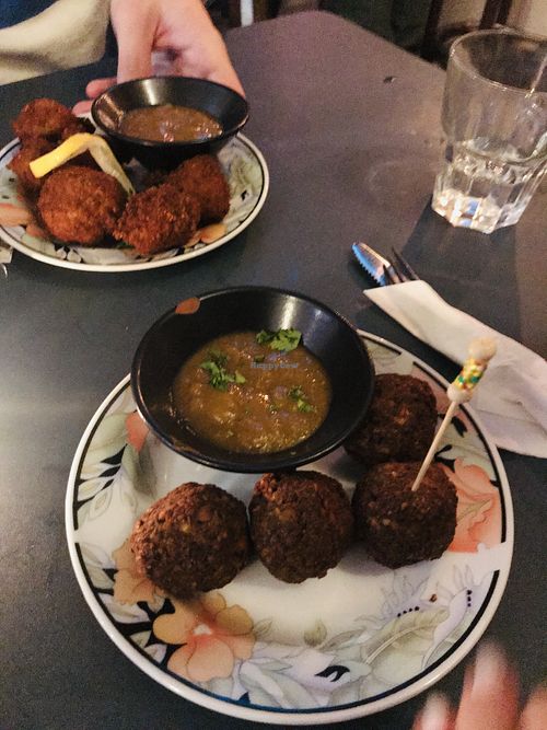 Top Kentucky’s fried cauliflower and bottom fried attieke balls at L'Embuscade in Paris