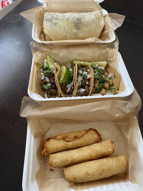 Potato taquitos, classic burrito, and various tacos  at Chicana Vegana in Fullerton