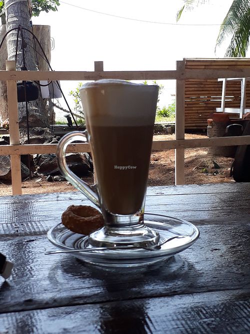Latte and vegan sesame biscuit at Hilush Bakery in Koh Phangan