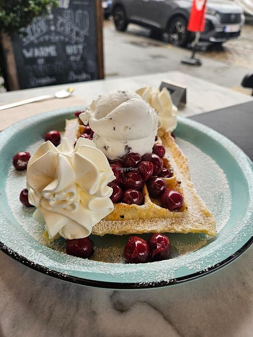 Stracciatella with warm cherries and whipped cream. And no those are matchstick head sizes cherries, there normal sized at IceLab NiceCream Creations in Antwerpen