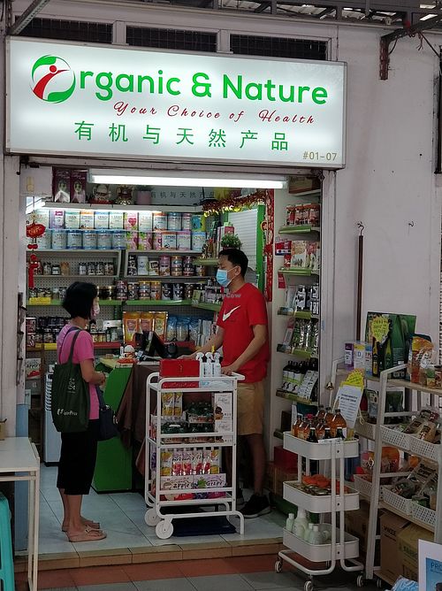Shop front. Masked up during Covid-19 situation at Organic & Nature in West Singapore
