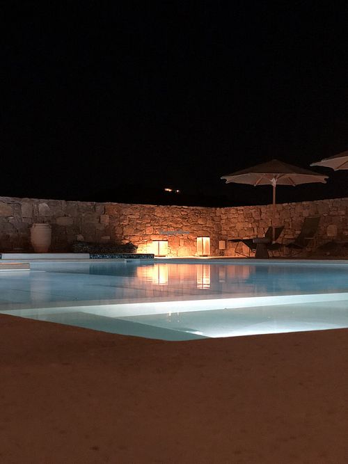 The pool at night  at Koukoumi Hotel in Mykonos