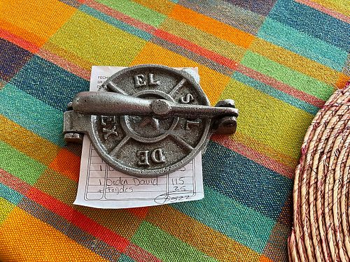 La cuenta (the check) in a mini tortilla press at Frida in Ajijic