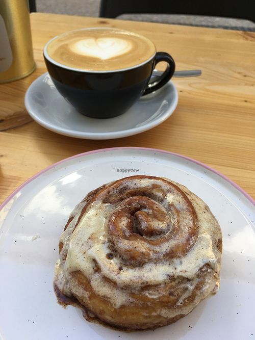 Cappuccino with almond milk and a fantastic cinnamon roll at Dear Rose Cafe in Ericeira