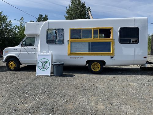 Facade with plenty of parking for customers at Preference in Anchorage