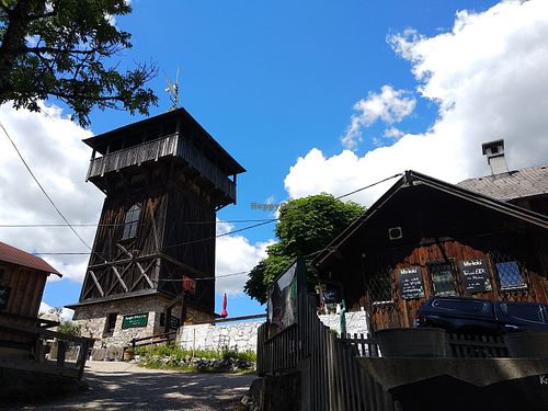 View of the backside of the restaurant with the Franz-Josef-Tower (accesible for free) directly besides the terrace entrance. at Gasthaus Siriuskogl in Bad Ischl