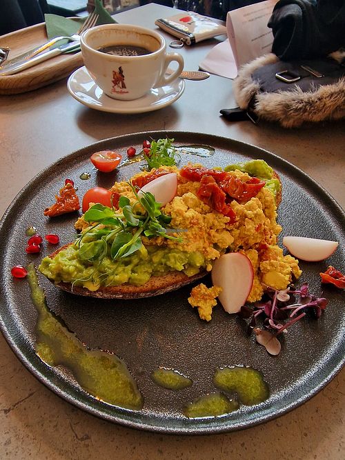 Scrambled egg avocado bread, breakfast before noon. at Kozy Eats  in Riga