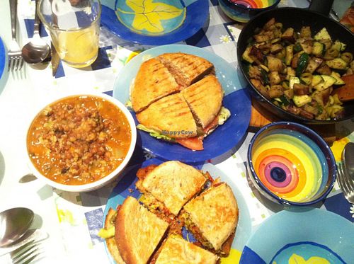 Final meal in Barcelona with take-out deliciousness; burger & sandwich from Gopal, soup from Vegetart and veggie stir fry from leftover veggies.  at Gopal - Vegan Deli in Barcelona