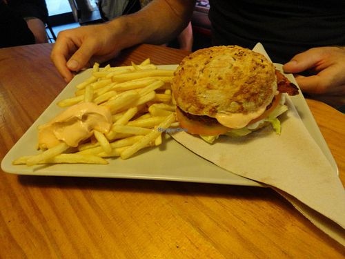 Vegan burger with fries at Gopal - Vegan Deli in Barcelona