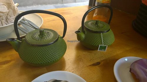 Green teas served in individual iron teapots( as a mealdeal with a donut) at Gopal - Vegan Deli in Barcelona