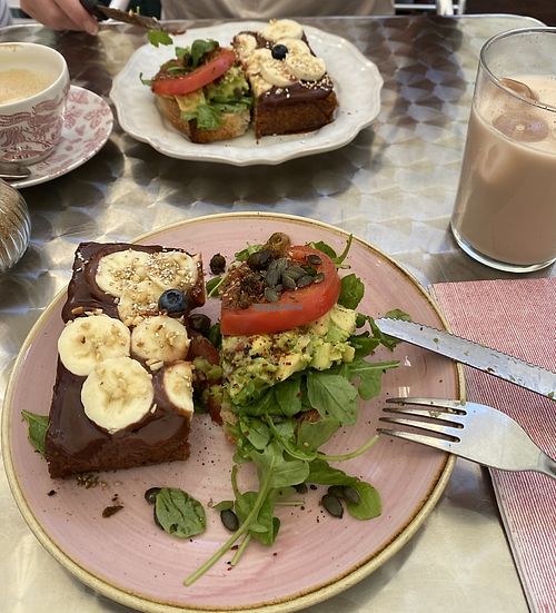 Avo sandwhich & monkey french toast  at OM NOM NOM CAFÉ in Munich