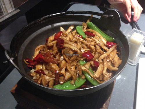 Spicy fake meat and mushrooms in a pot at Tianchu Miaoxiang - Chaowai in Beijing