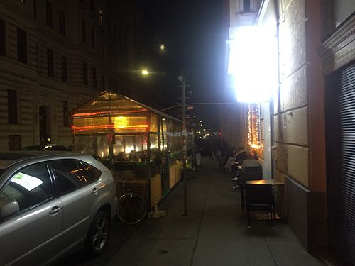 The Vevi outdoor seating at night at Vevi in Vienna