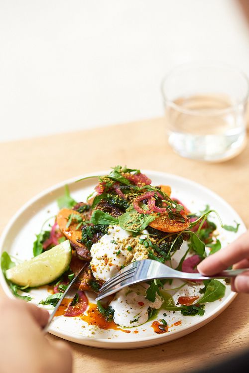 Fritters with cream cheese, salsa verde, pickles at NEØ Coffee House in Barcelona