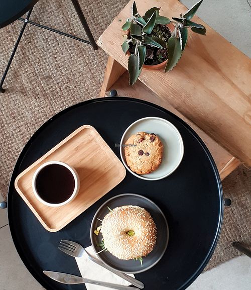 Vegan breakfast with bagel and black coffee at NEØ Coffee House in Barcelona