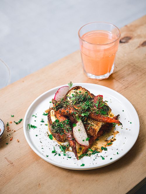 Seasonal toast with hummus, roasted carrot, chimichurri at NEØ Coffee House in Barcelona