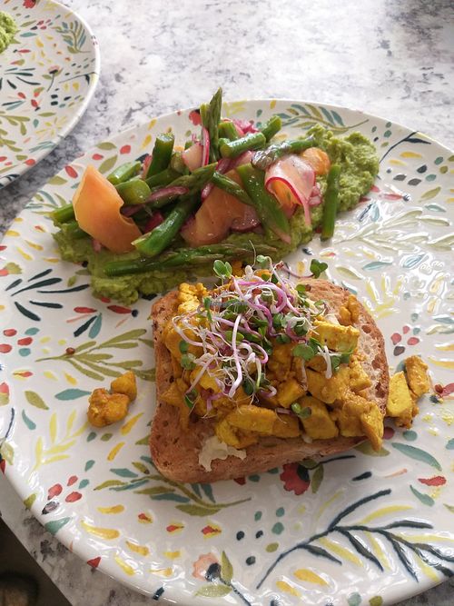 Vegan eggs on gluten free toast with Asparagus Salat on green Pea Guacamole at Vegantisch  in Alicante