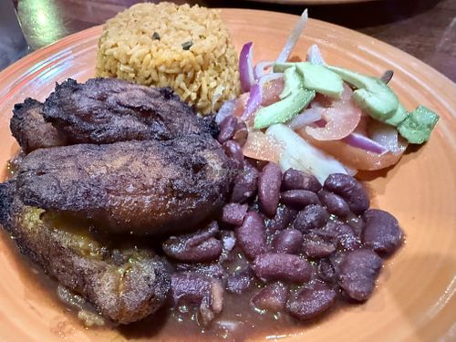 Yellow rice, beans, sweet plantain, avocado saladd  at El Coqui in Santa Rosa