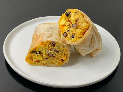 breakfast burrito (cut in half + plated at home) at Central Cafe and Juice Bar in Seattle