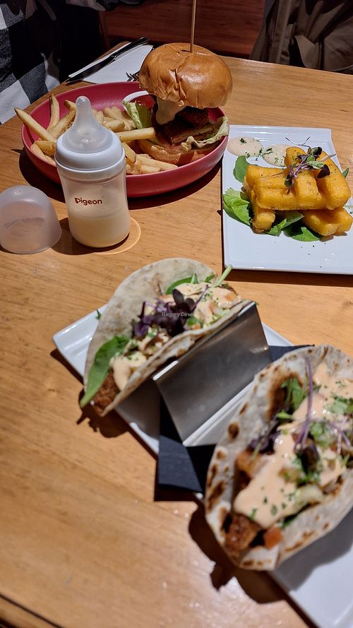Vegan banana blossom fish taco and burger with polenta fries. Fairly good food with amazing view of the lake. Friendly wait staff who put us next to the heater as we had baby. at Social Club in Taupo