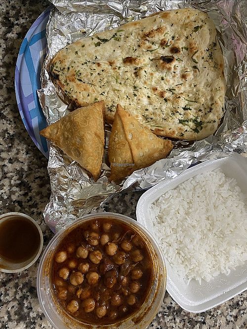 Samosas, garlic naan, chana masala (comes w/ rice)  at Veggie Bros in Austin