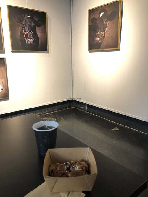 Cinnamon rolls in front of photoart.  at Station Grön in Raettvik