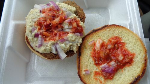 Baba falafel burger with onions and hot sauce. at Troy Grille in Kent