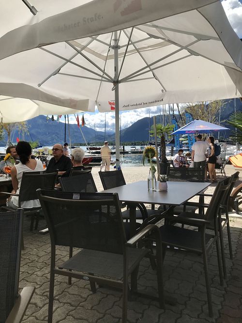 Relaxed outdoor seating by the lake   at Naked Flowers in Mondsee