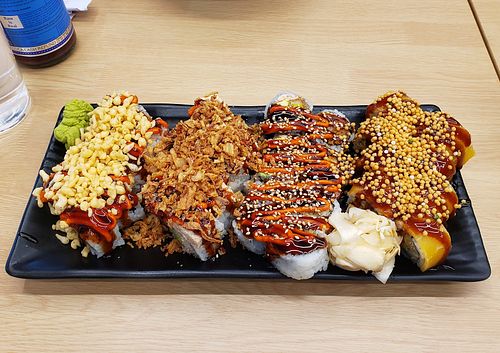 ebi tempura, krunchy krab, kakiage supreme, smoky sake at Wellness Sushi in Denver