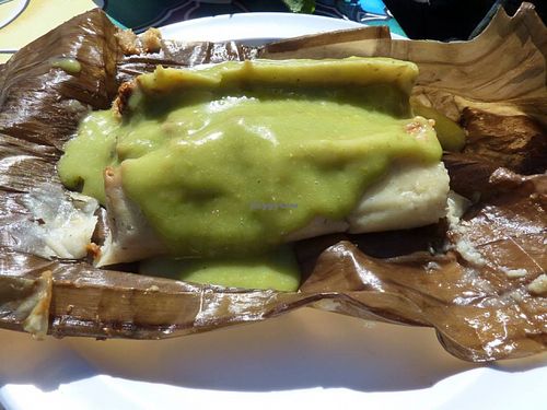 Banana leaf wrapped tamale - corn masa, olives, capers, potatoes, TVP, mole sauce, salsa. Good eats! at Flacos in Berkeley