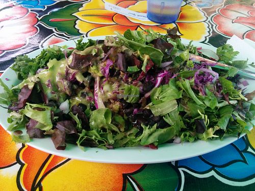 Huaraches - large handmade organic corn tortilla layered with avocado, black beans, rice, cilantro, onions, red cabbage, radishes & salsa. at Flacos in Berkeley