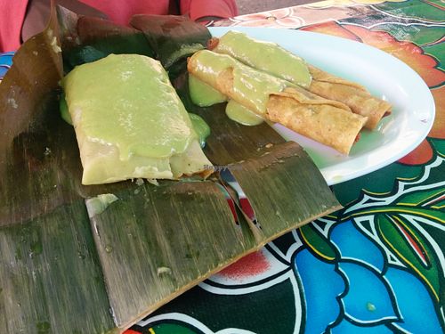 2 taquitos - textured soy protein rolled in corn tortilla & fried, with banana leaf tamale  at Flacos in Berkeley