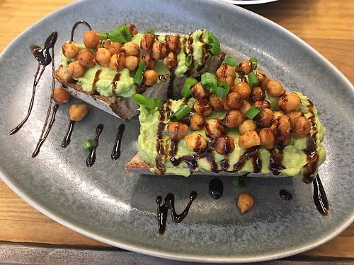 Avocado toast topped with roasted chickpeas at Buna in Lisbon