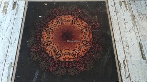 I loved this beautiful drawing on the floor. at Brio in Tarifa