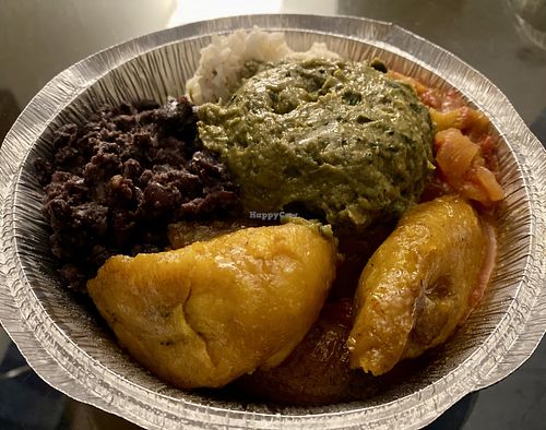 Bowl with black beans, sofritos, plantains, coconut rice and guacamole .  at The Floribbean in St Petersburg