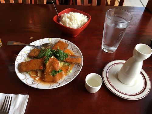 Lemon basil fish with a side of rice and hot sake at Garden Fresh in Palo Alto