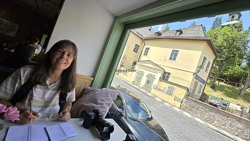 Alexandra enjoying the view at our table at Lemberg Bistro in Banska Stiavnica