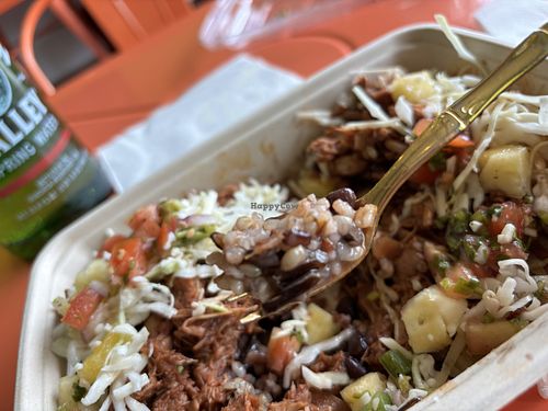 BBQ veggie bowl has brown rice (and some other kind of rice), black beans, BBQ jackfruit, cabbage, vegan cheese shreds, and pineapple salsa  at Juice N Blendz in Massapequa