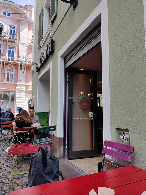 Outdoor seating. There is a one way system walk through. at Amara in Freiburg