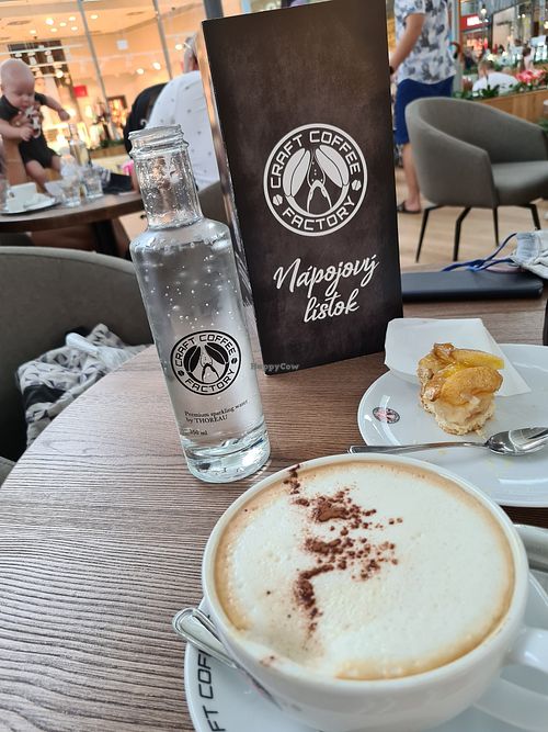 Soy milk cappuccino and nearly finished vegan apple pie at Craft Coffee Factory in Bratislava