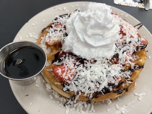 Chocolate and Strawberry waffle with coconut whipped cream 😍  at Donut Villa Diner in Malden