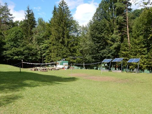 Rex's Bar, campfire and solar panels at ECO River Camp in Globoko