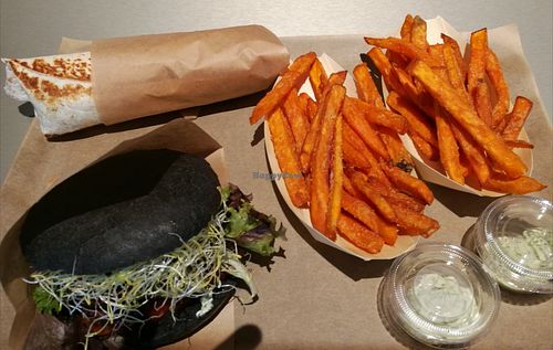 Two orders:
Pulled BBQ Burger (Combo=fries+dips) and 
Burrito Wrap(Combo=fries+dips)
Sweet potato fries. at Two Monkeys  in Malmo