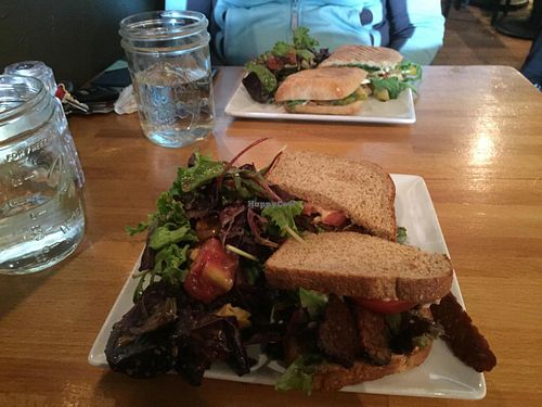Vegan Tempeh BLT (front) and Vegetarian Roasted Apple and Brie Panini (back)  at Cafe Nola in Frederick