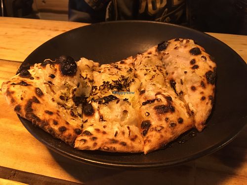Garlic bread, with oregano and cheese at Plant Base in Lisbon