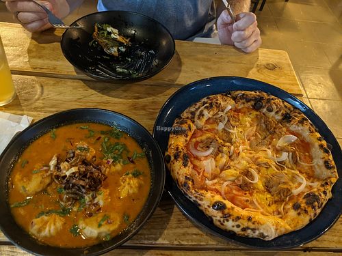 Momo and pizza at Plant Base in Lisbon