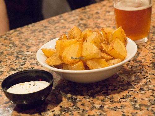 Fried cubed potatoes with a garlic sauce at Cat Bar in Barcelona