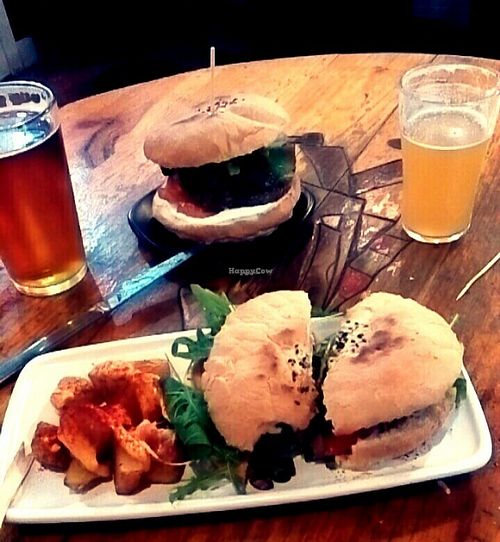 Champiñon burger with potatoes and black burger, pale indian ale and gluten free beer  at Cat Bar in Barcelona