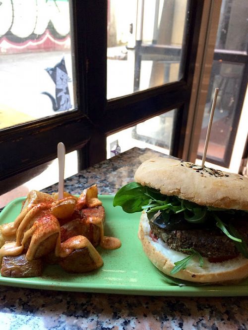 Hemp burger with patatas bravas at Cat Bar in Barcelona